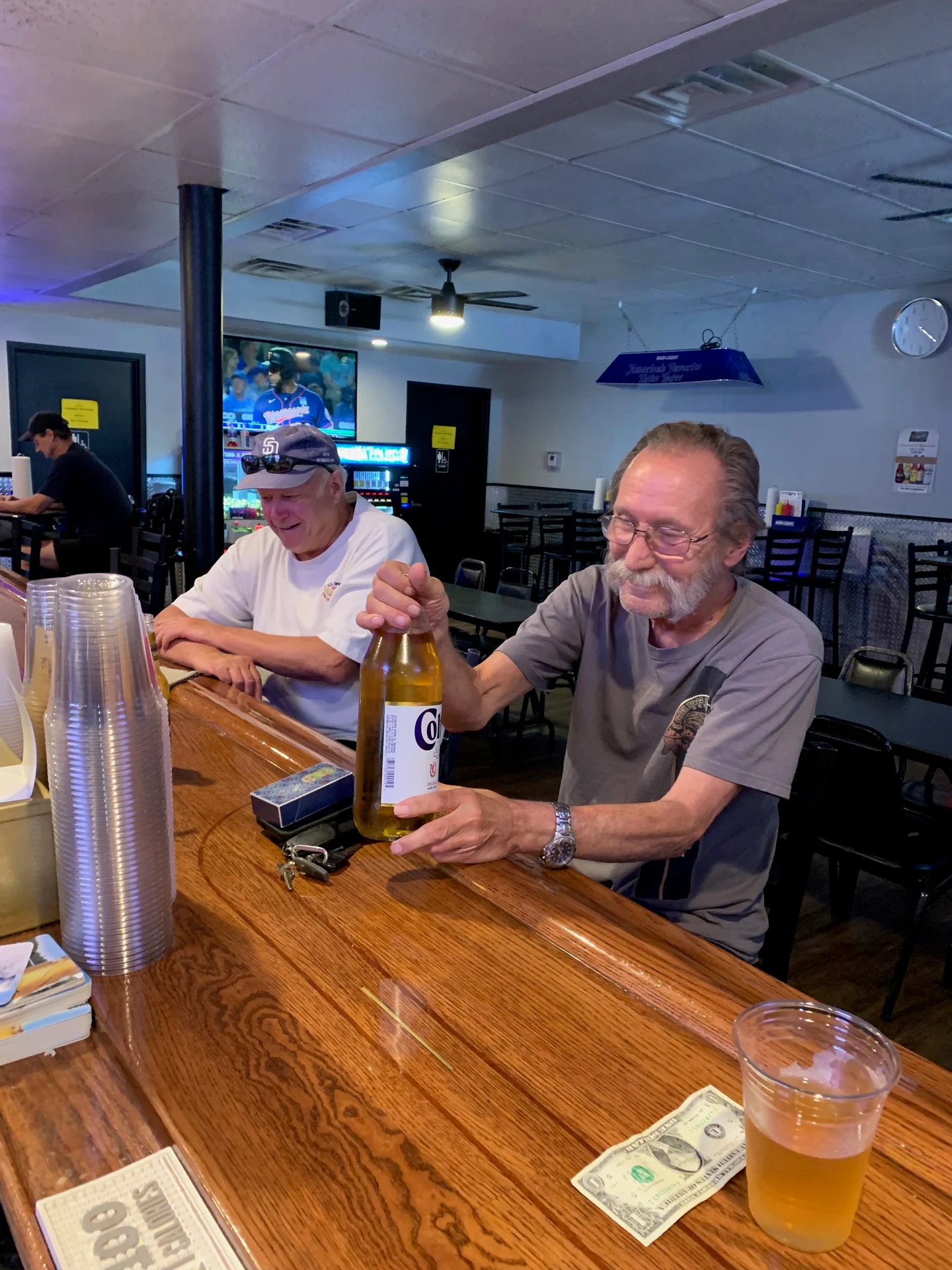 Customers posing in front of the camera inside Cedar Inn