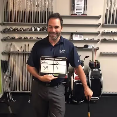 Male golfer showcasing Golf Fitting game improvements 