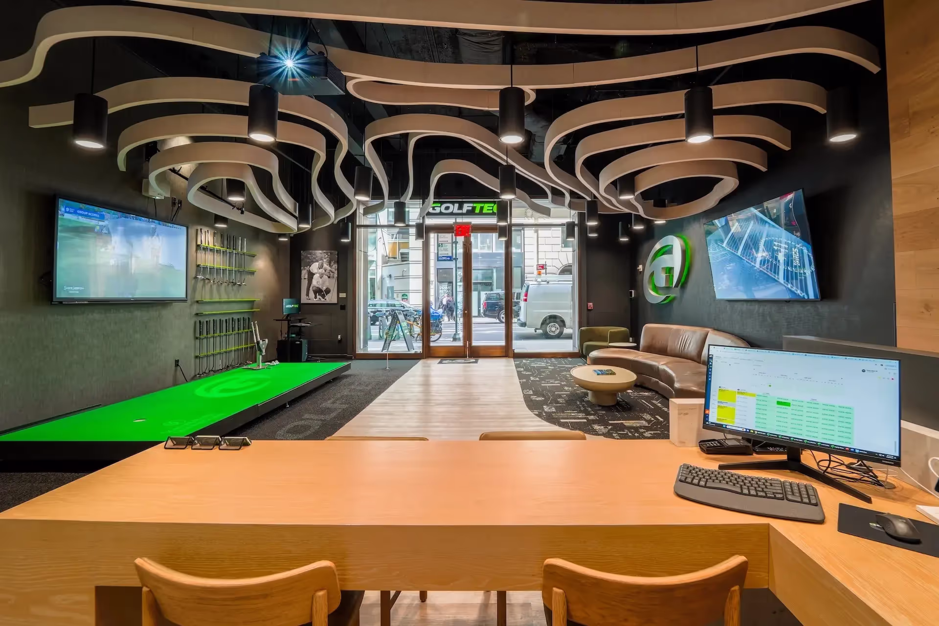 View of the front entrance of a GOLFTEC center
