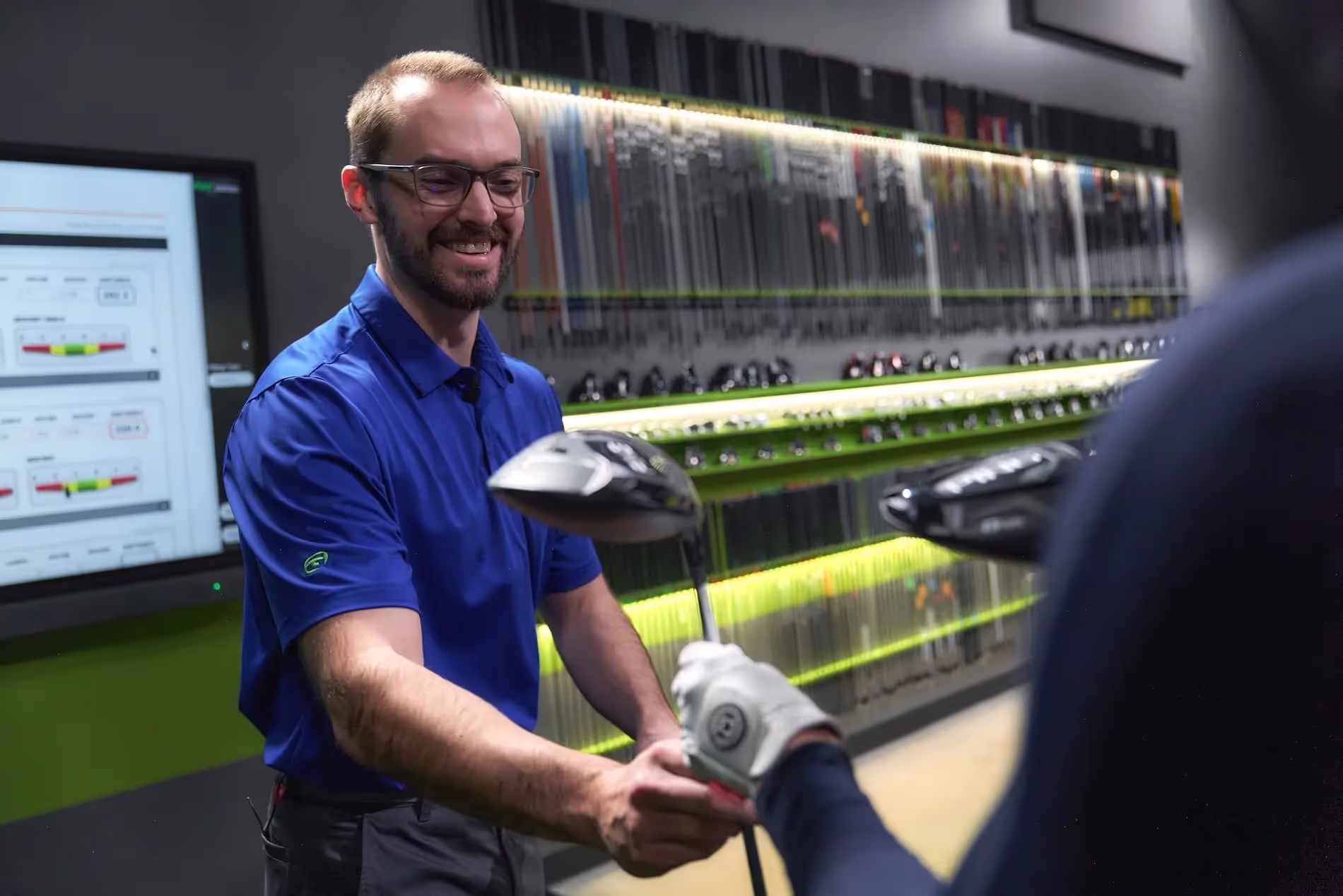 GOLFTEC club fitting session trying different clubs