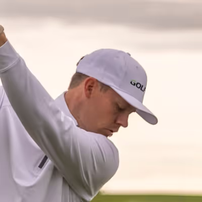 Man focused on ball during backswing