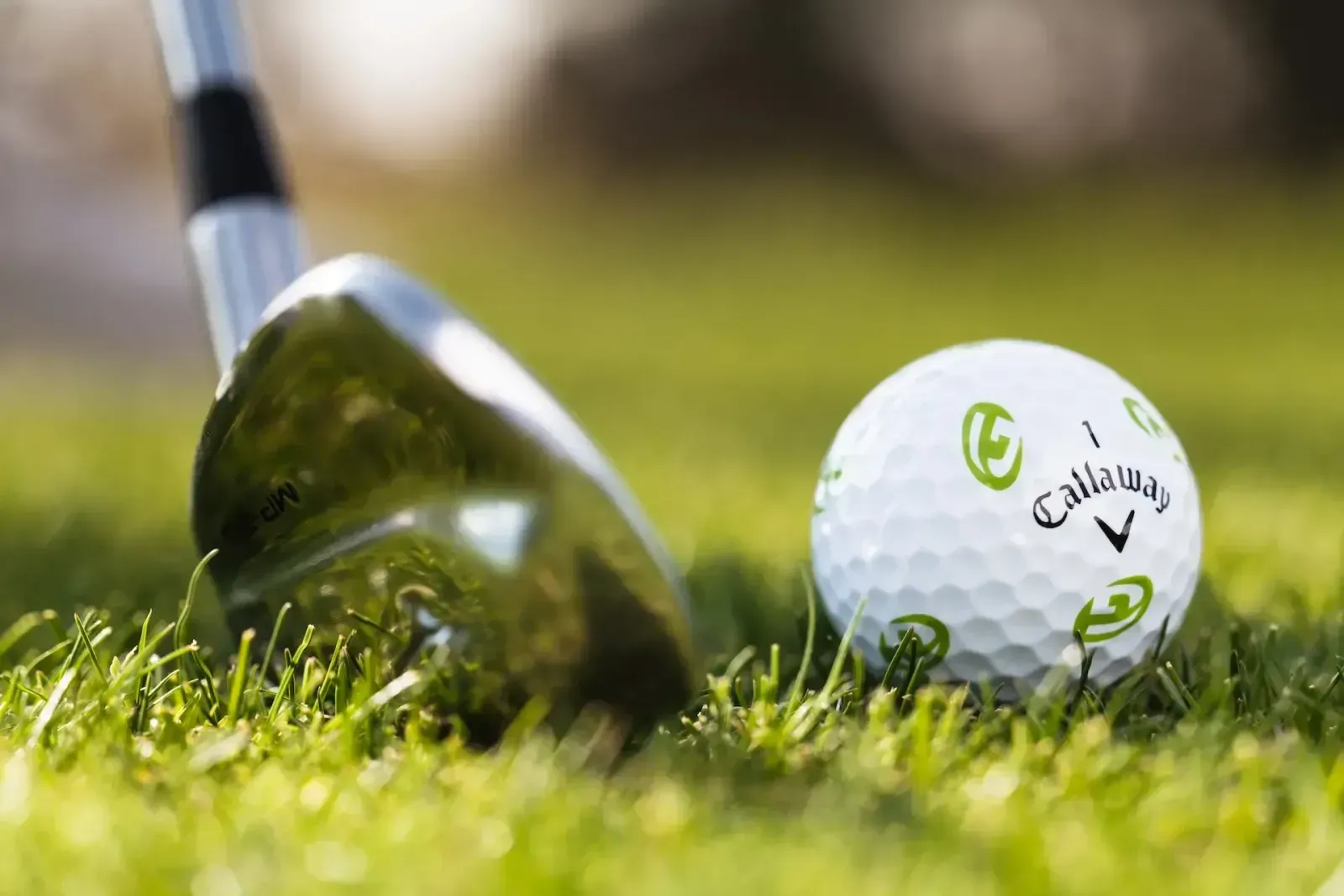 Callaway GOLFTEC ball being hit on the fairway with a wedge