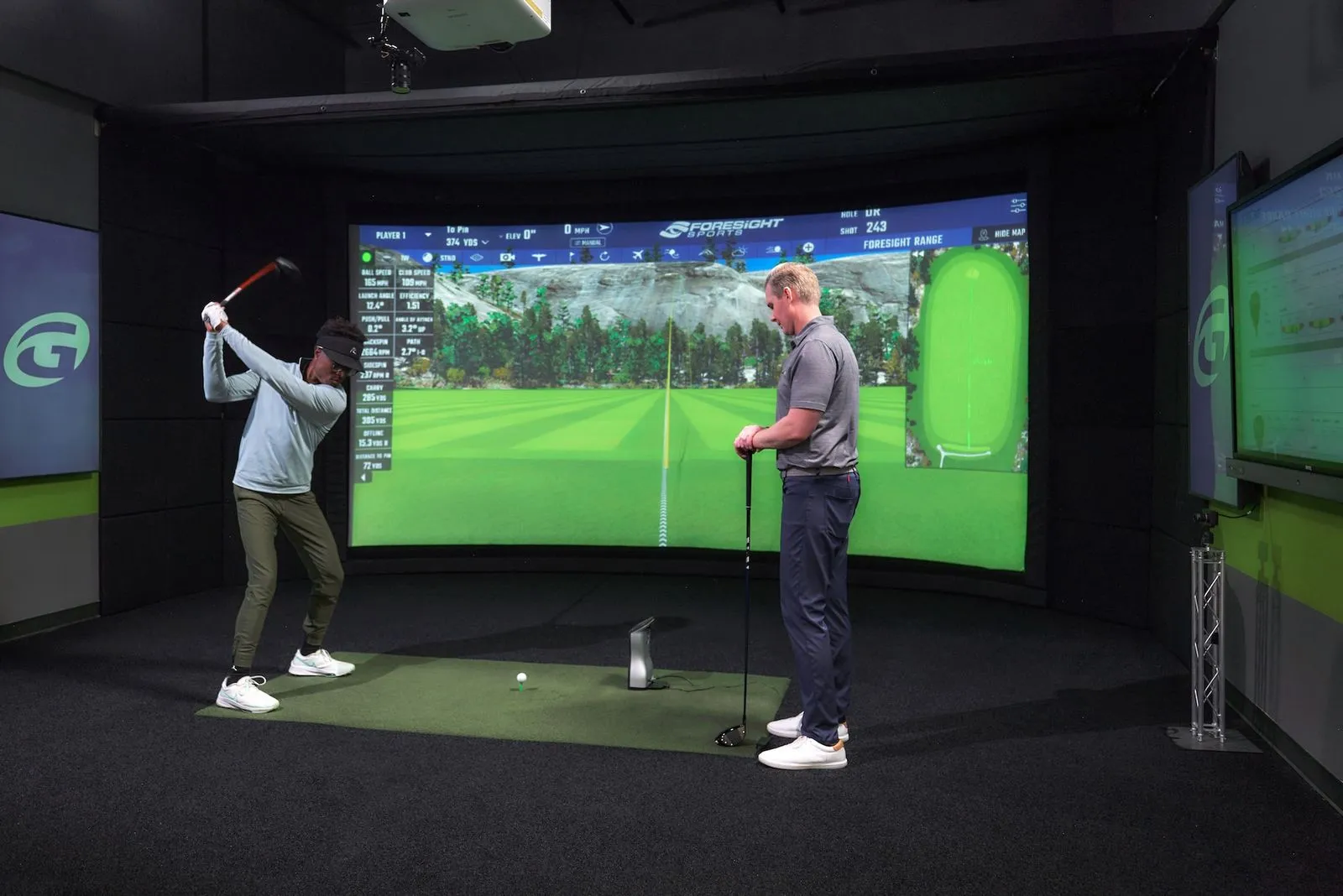 Indoor golf lesson at GOLFTEC personalized coaching and golf simulator technology