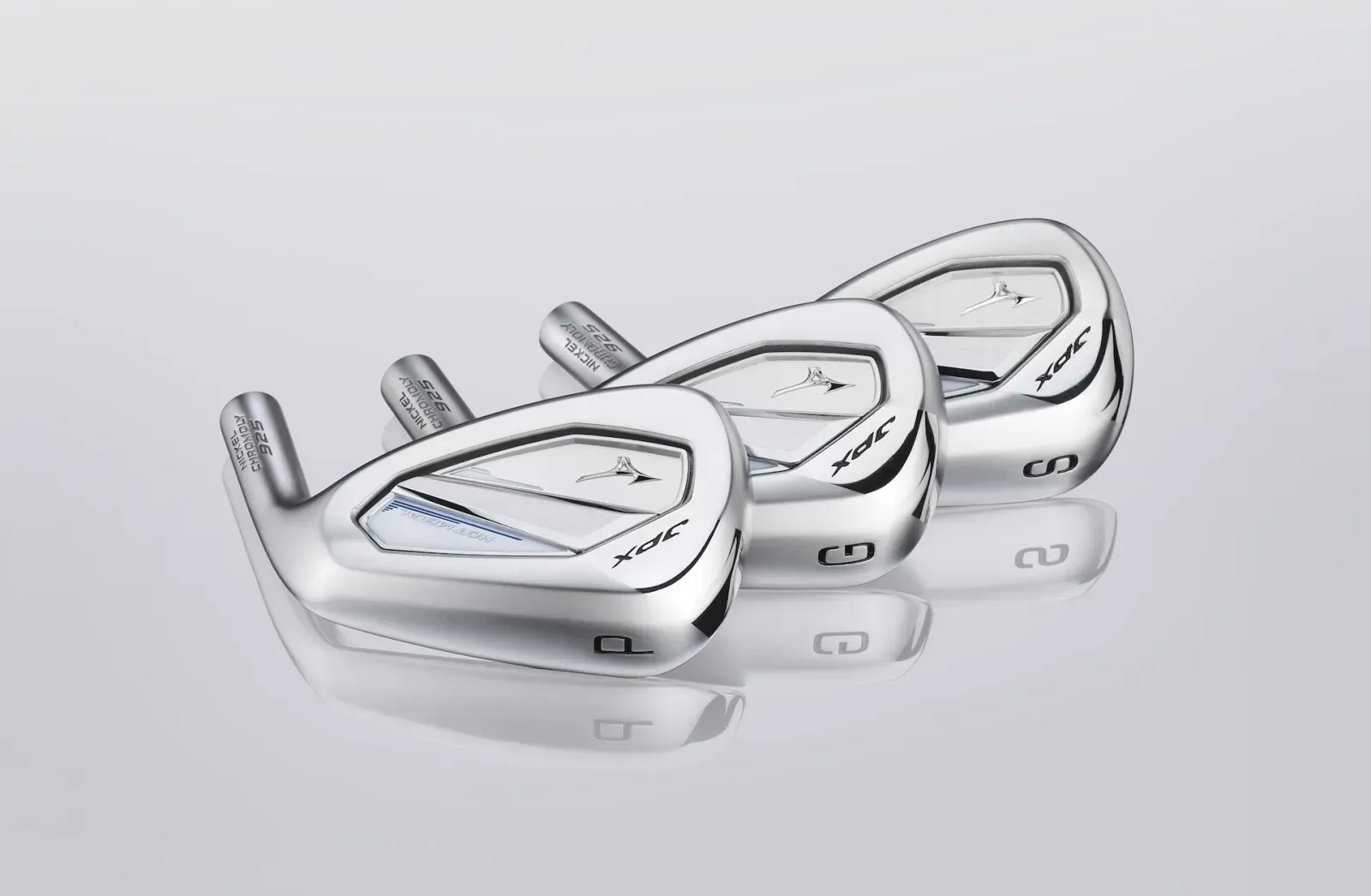 Three Mizuno JPX925 hot metal iron heads displayed on a silver background, highlighting their bright finish