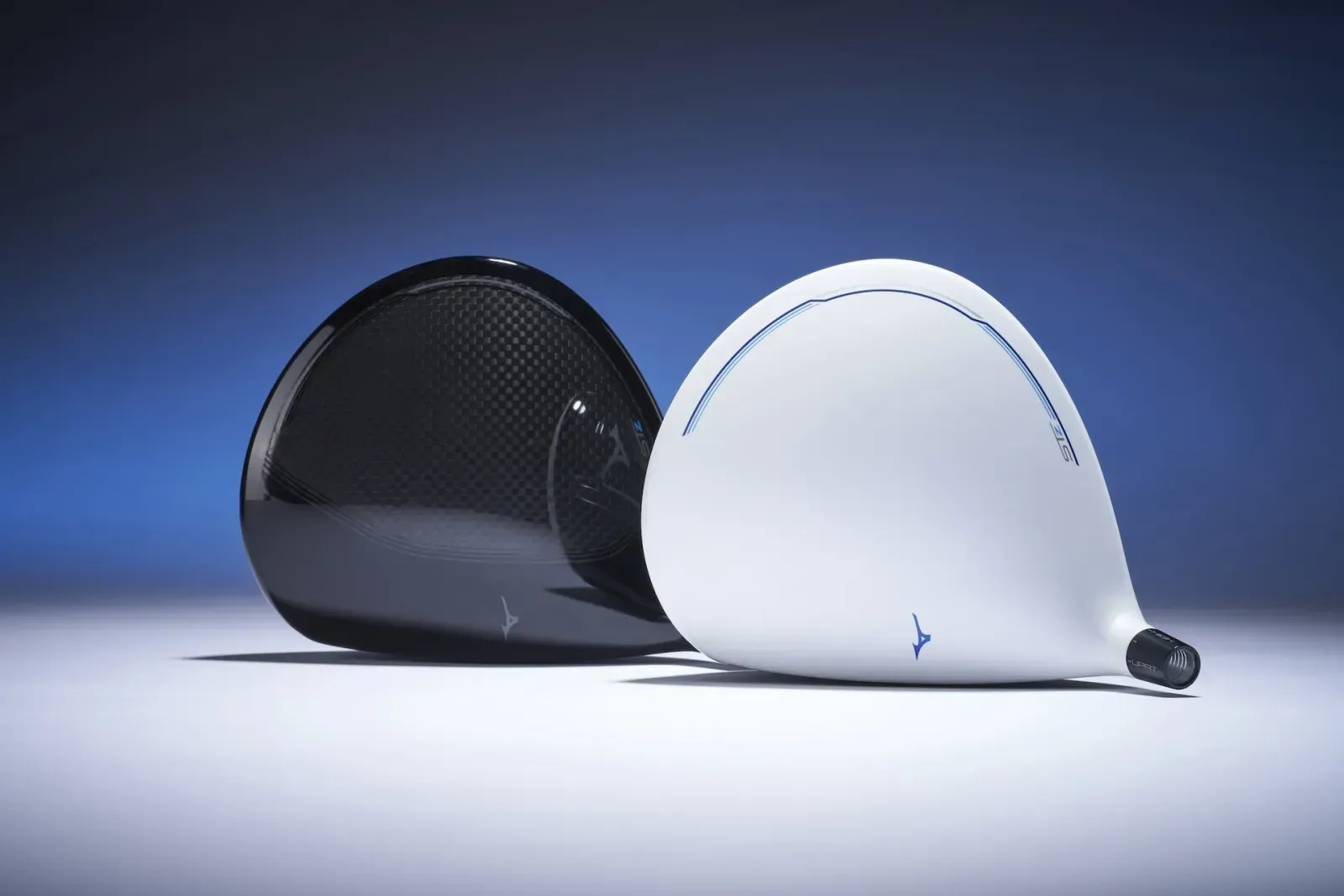Mizuno ST-Z 230 drivers, white and black clubheads, against a blue background and on a white surface