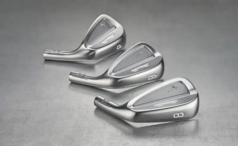 Three Mizuno PRO S-3 iron heads lined up on a grey surface. 