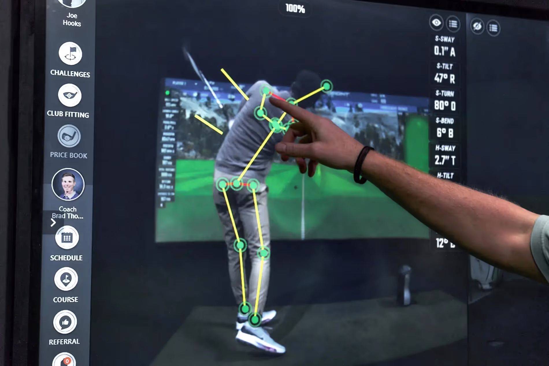 GOLFTEC coach breaking down student swing with OPTIMOTION.