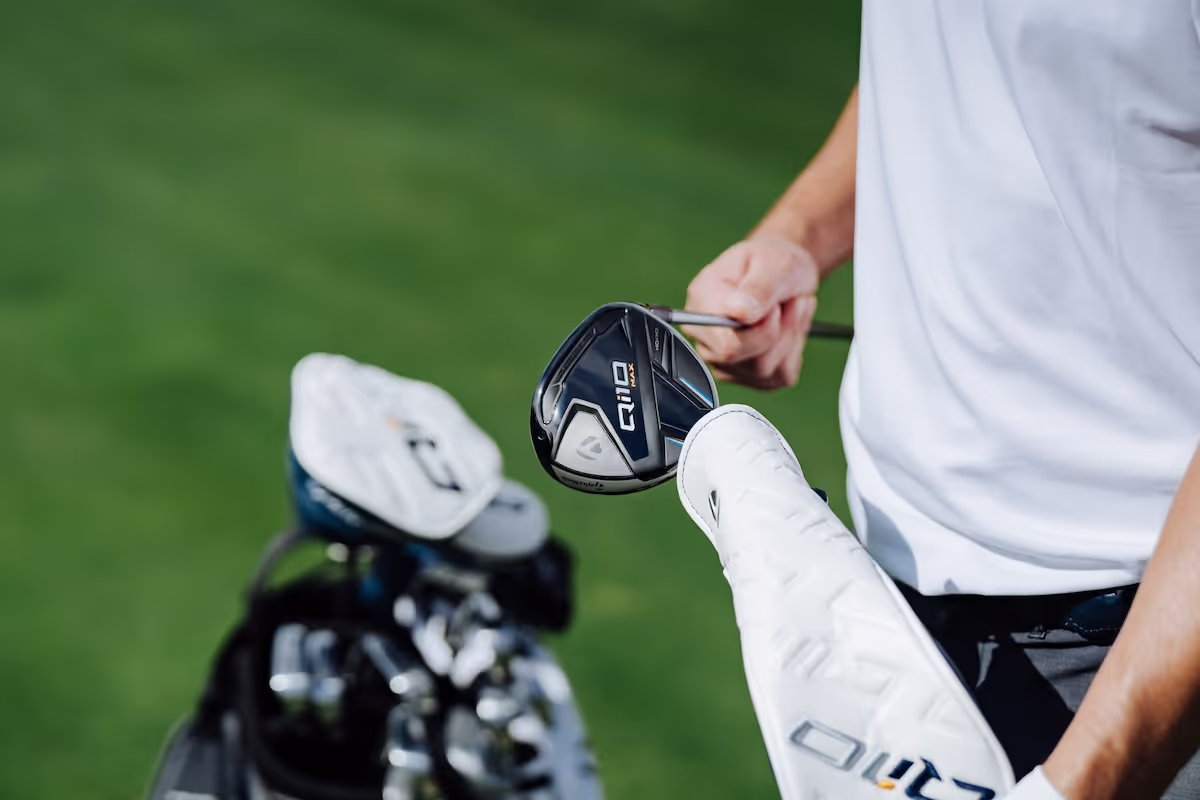 TaylorMade Qi10 Max driver being removed from its headcover on the course. 