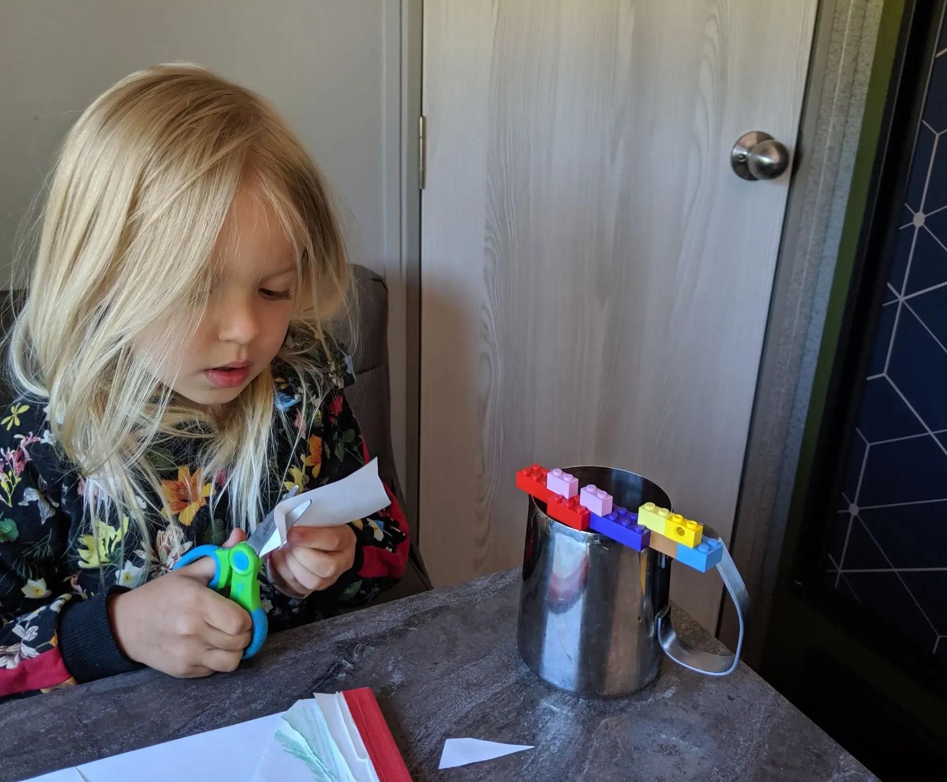 Child doing homeschool activities while traveling in a travel trailer