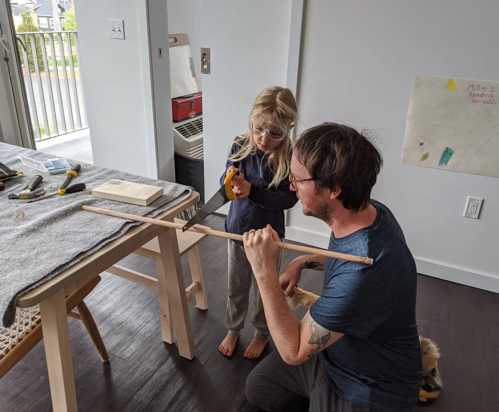 Dad and daughter completing a homeschool project together