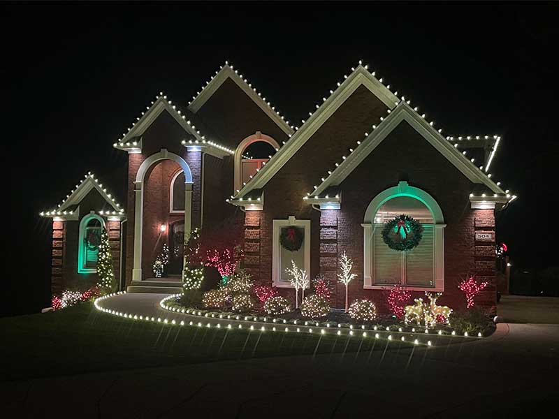 time and cost savings for Christmas lights with wreaths and bushes