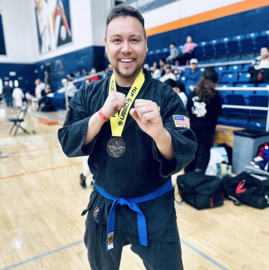 Blue Belt Adult Karate student with his hands on guard.