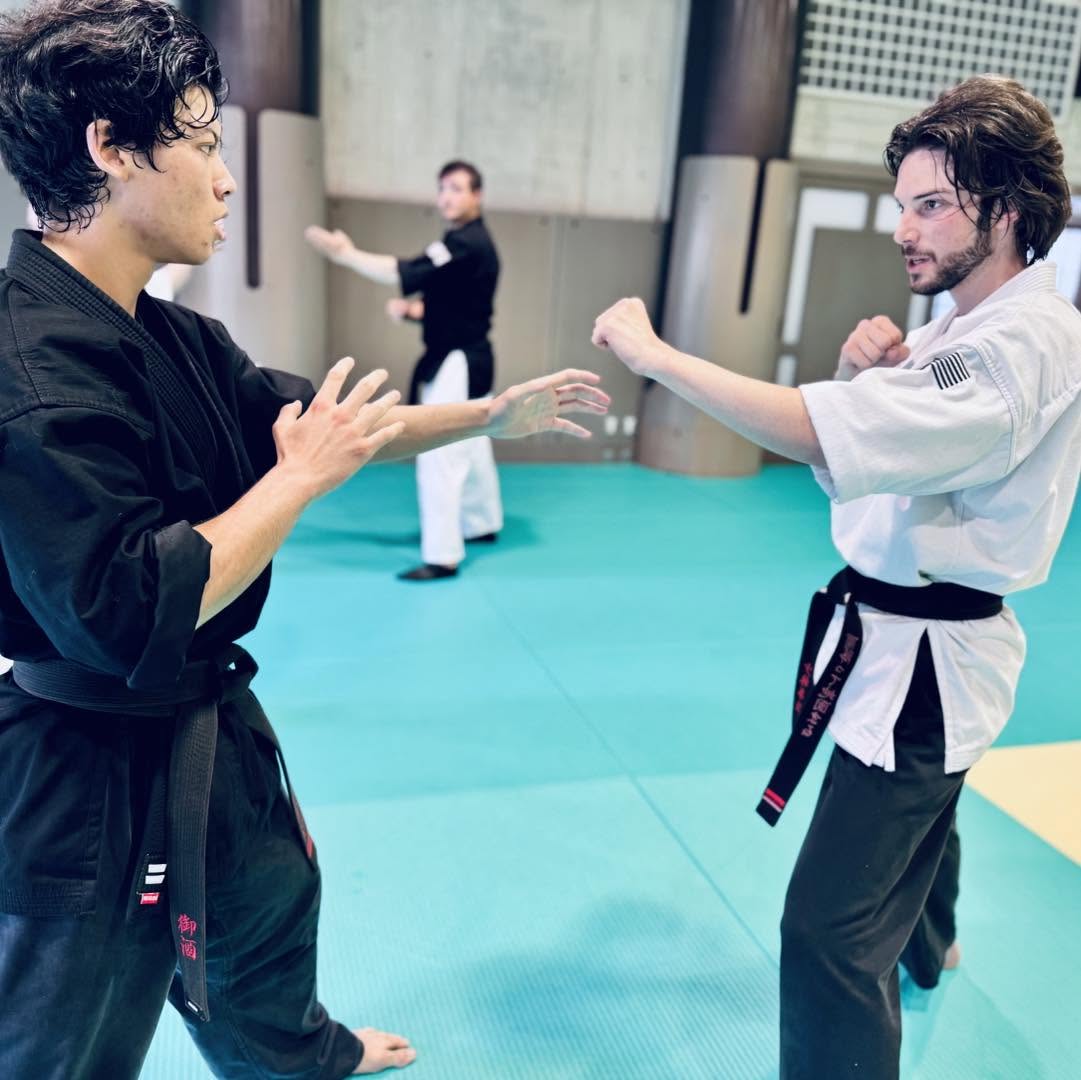 Two Adult self defense students on guard and ready to spar.