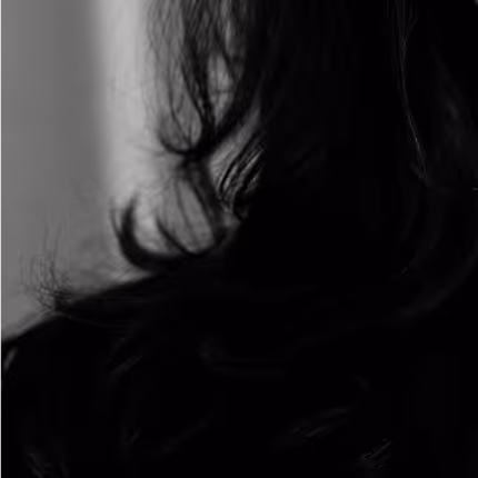 Close-up black and white photo of long, wavy dark hair with soft lighting.