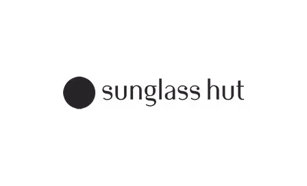 Sunglass Hut logo with a solid circle to the left of the text.