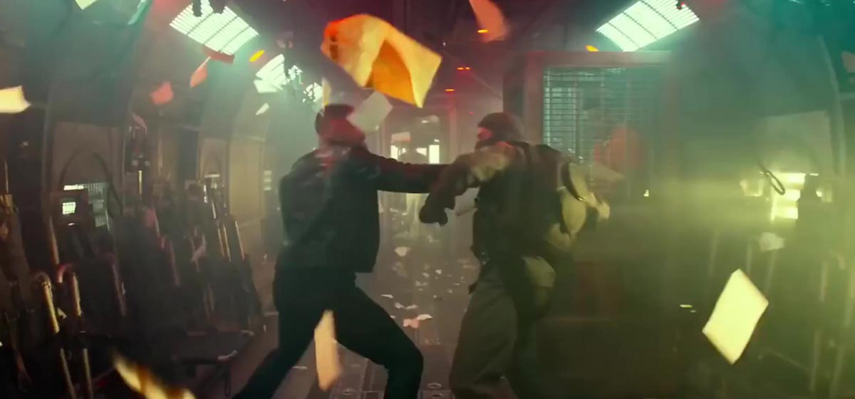 Will Smith and a soldier fight hand to hand inside of a military aircraft