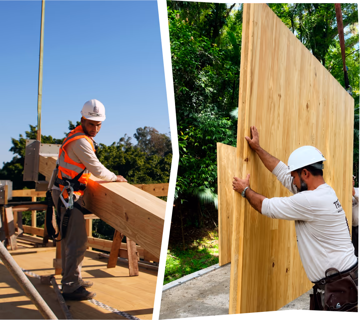 Dois trabalhadores da construção posicionam vigas e painéis de madeira engenheirada ao ar livre.