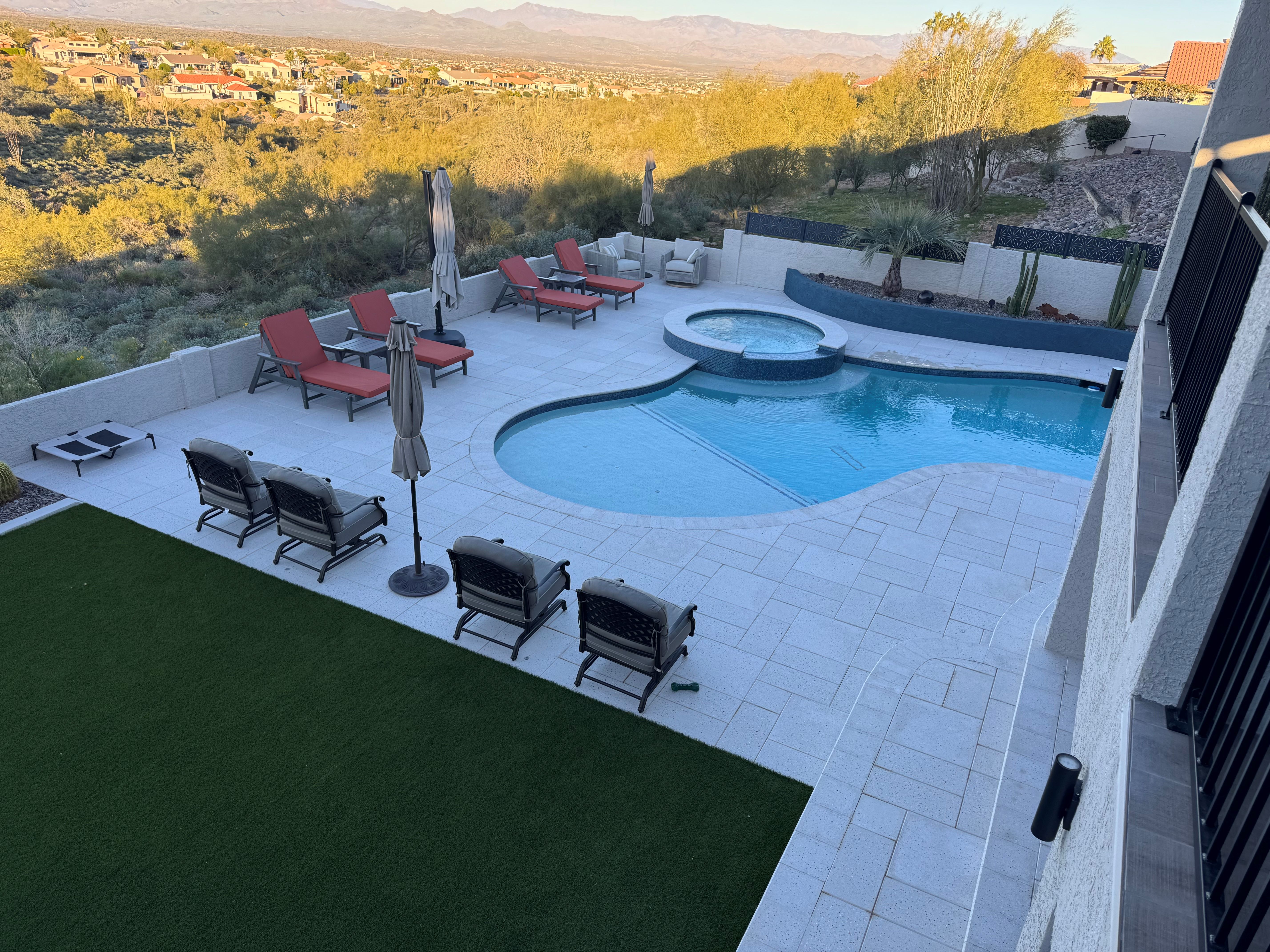 Phoenix pool builder — Fountain Hills hillside backyard remodel with grade reduction from 30-degree slope to zero, complete patio rebuild