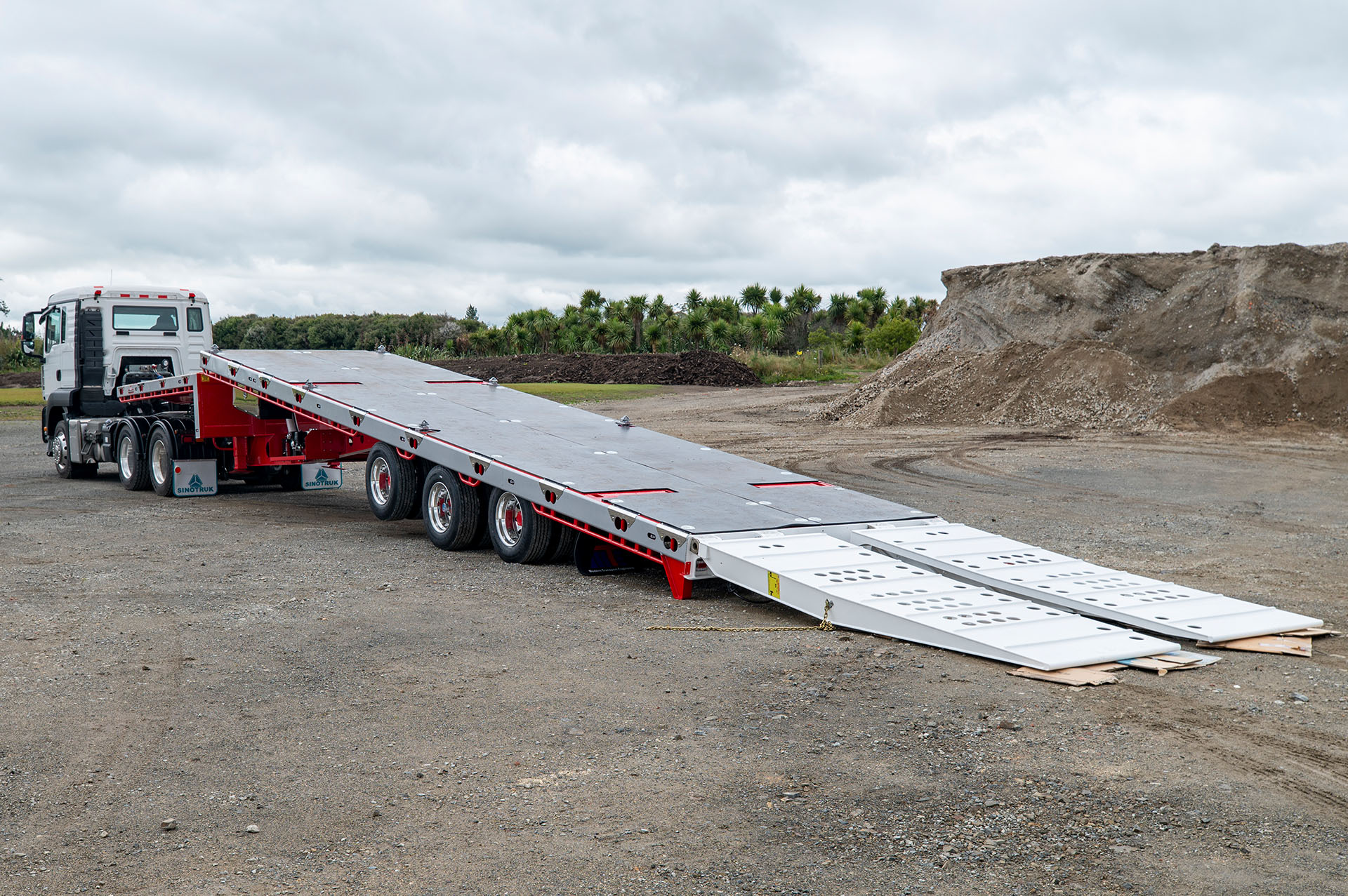 3 Axle Semi Tilt Deck Transporter Back Angle With Ramps Down 