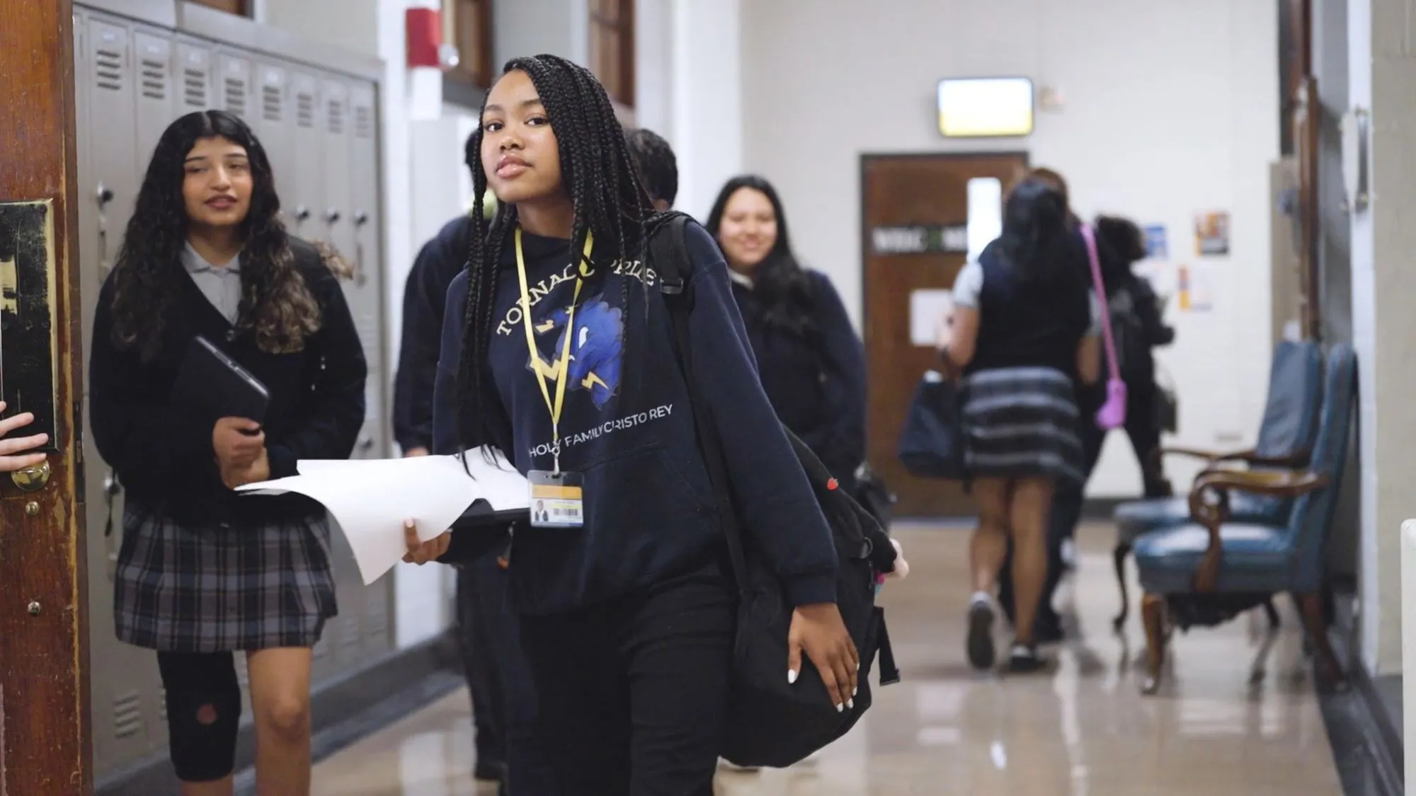 Students walk through the hallways at Holy Family Cristo Rey Catholic High School