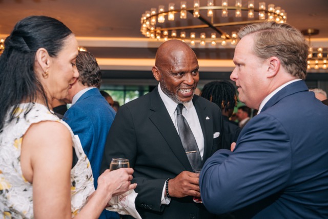 The President of Holy Family Cristo Rey mingles with guests at the 2025 Rey of Hope Gala