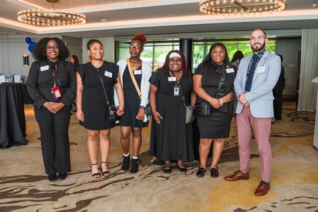 Students and staff of Holy Family Cristo Rey pose for a photo during cocktail hour at the 2025 Rey of Hope Gala