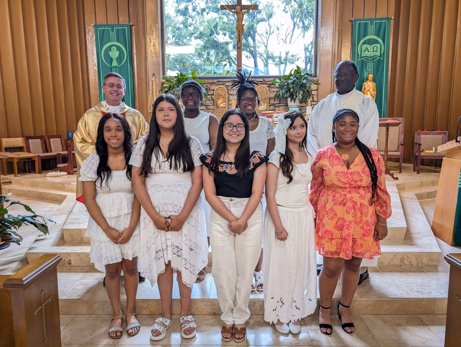 Holy Family Cristo Rey students in the "Journey with Christ" Sacramental Preparation Class receive the sacraments of Baptism, First Communion, and Confirmation at Our Lady of Fatima Catholic Church