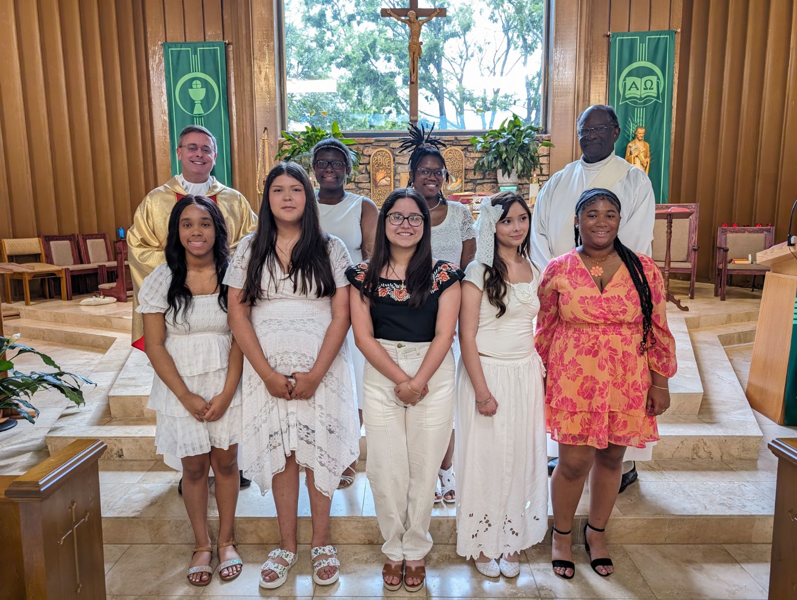 Holy Family Cristo Rey students in the "Journey with Christ" Sacramental Preparation Class receive the sacraments of Baptism, First Communion, and Confirmation at Our Lady of Fatima Catholic Church