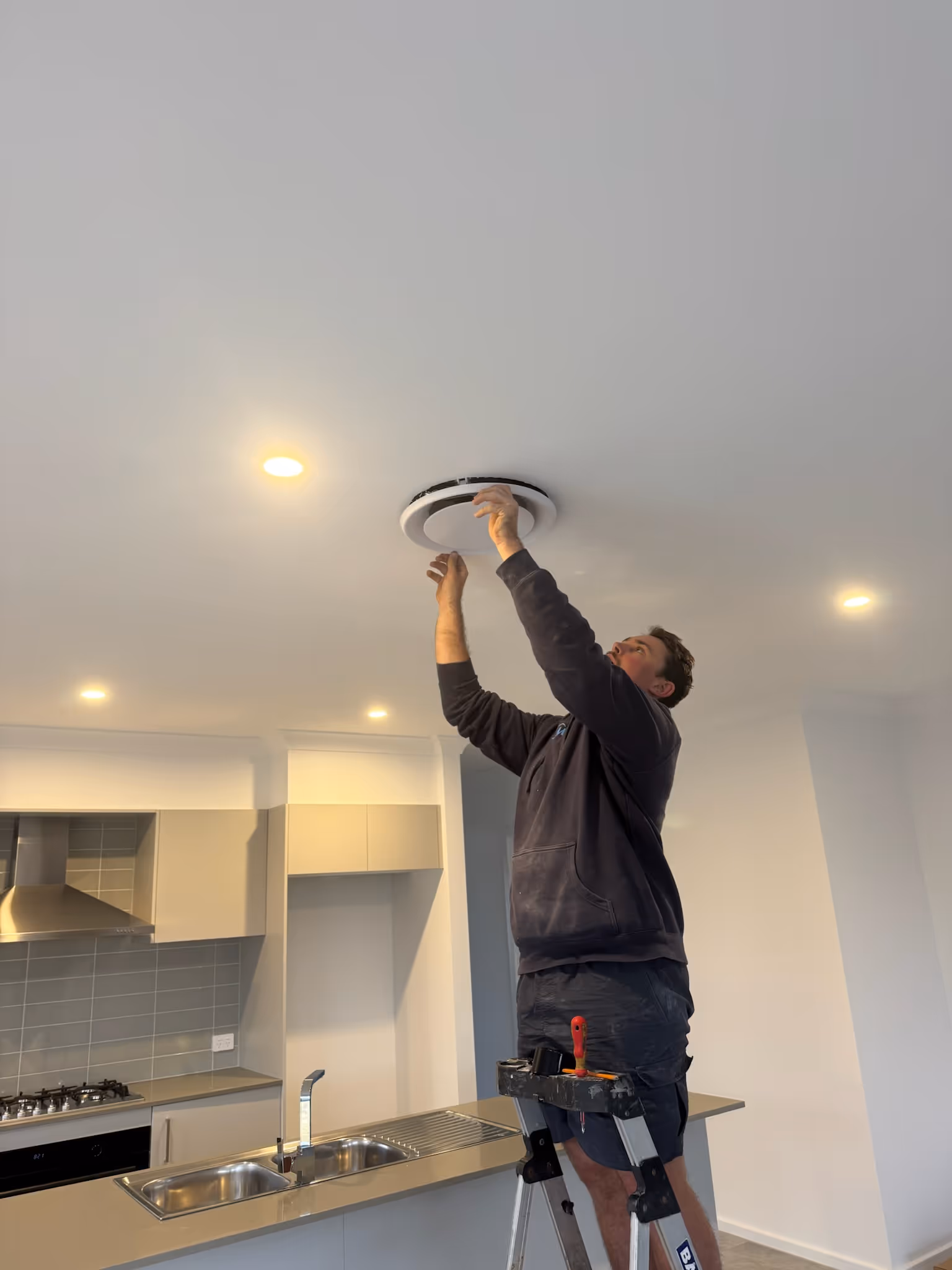 A man fixing an air conditioner