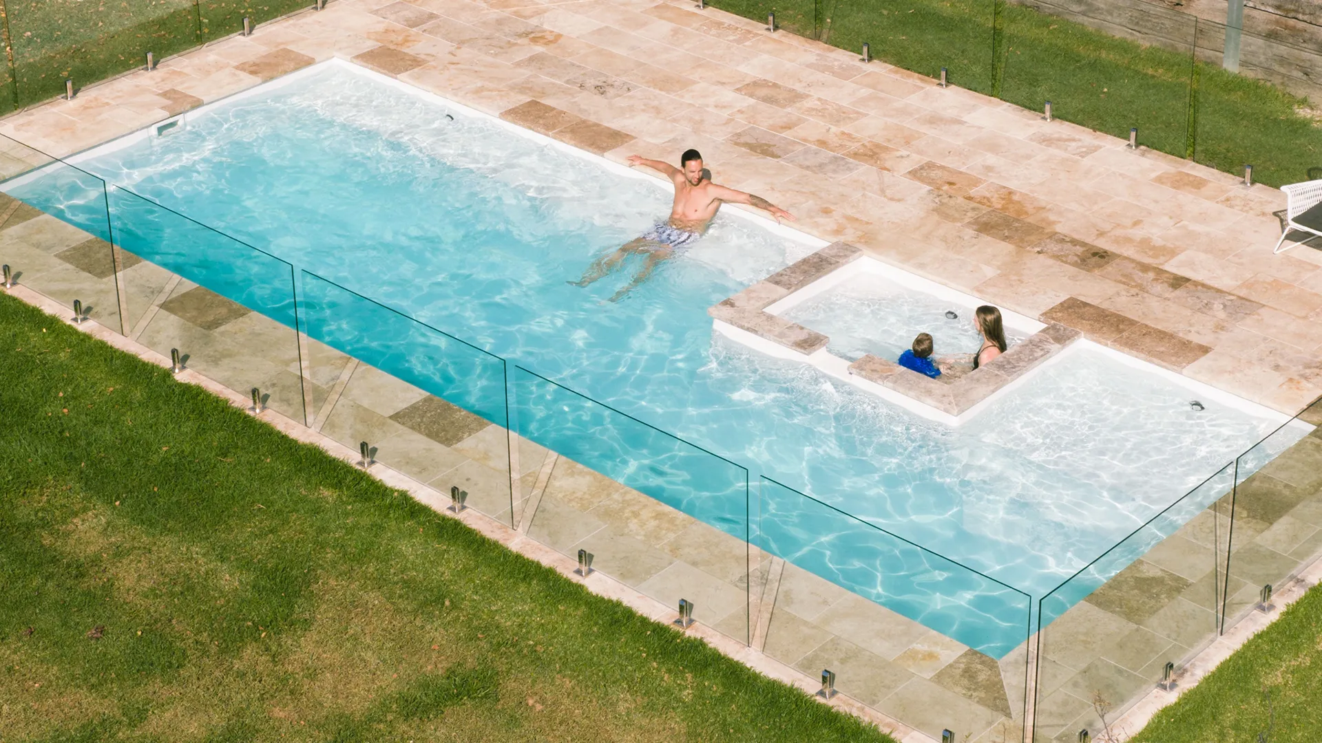 The Peninsula is a pool and spa combination with a rectangular spa down one side of the pool from Summertime Pools