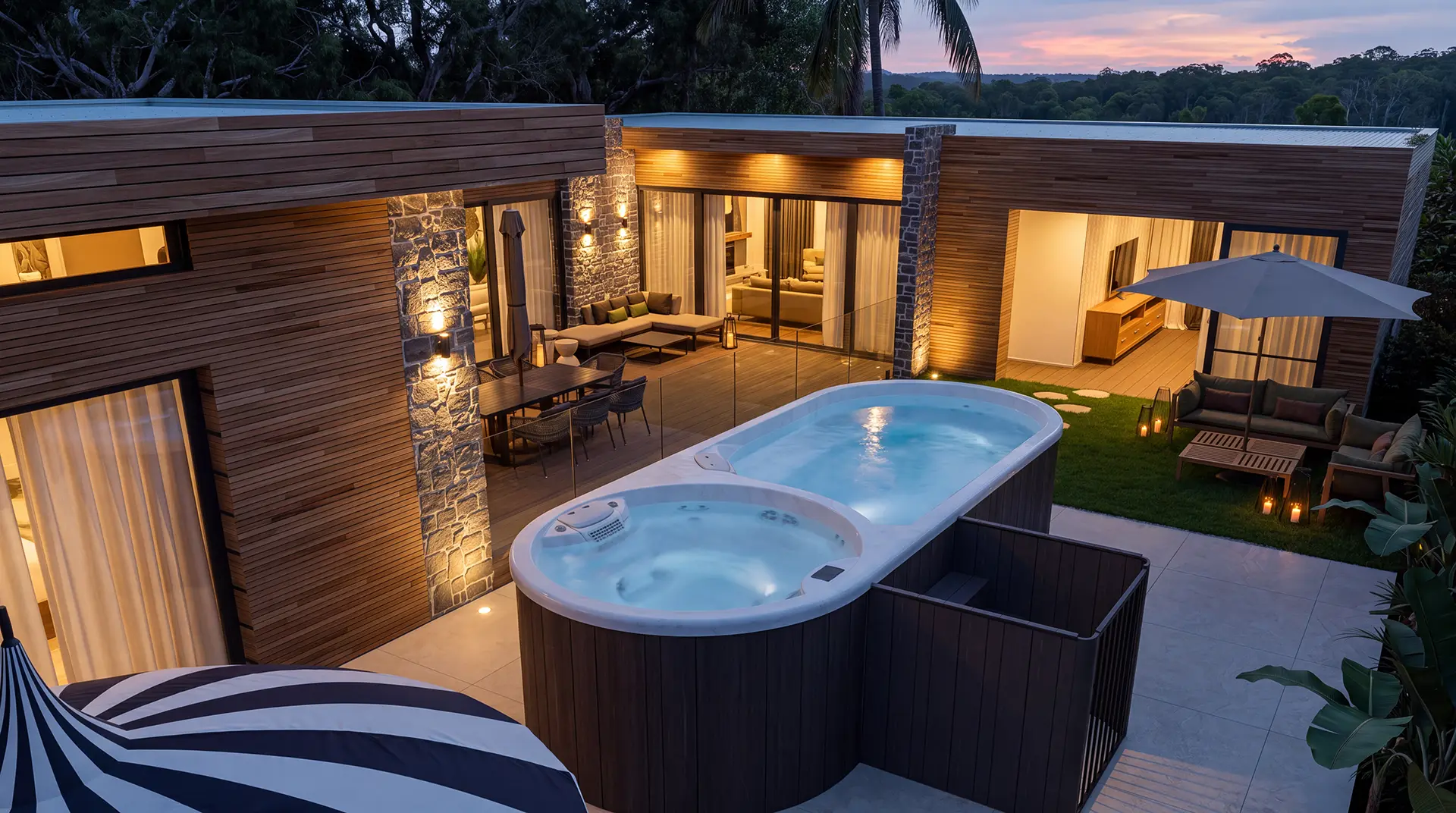angular view of round plunge HALO Spa in a luxury backyard
