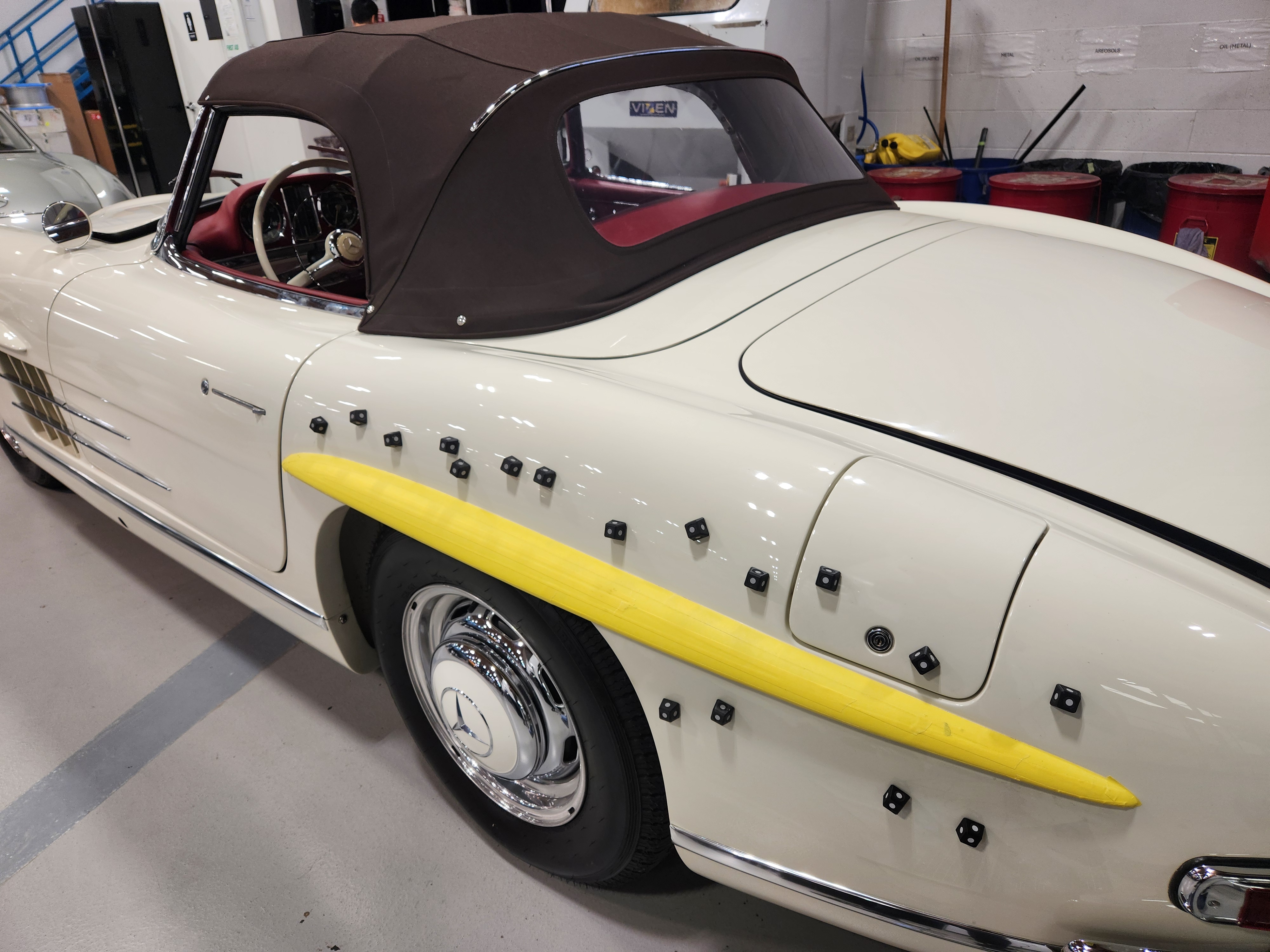 Side view of a 62 mercedes dotted with scanning markers