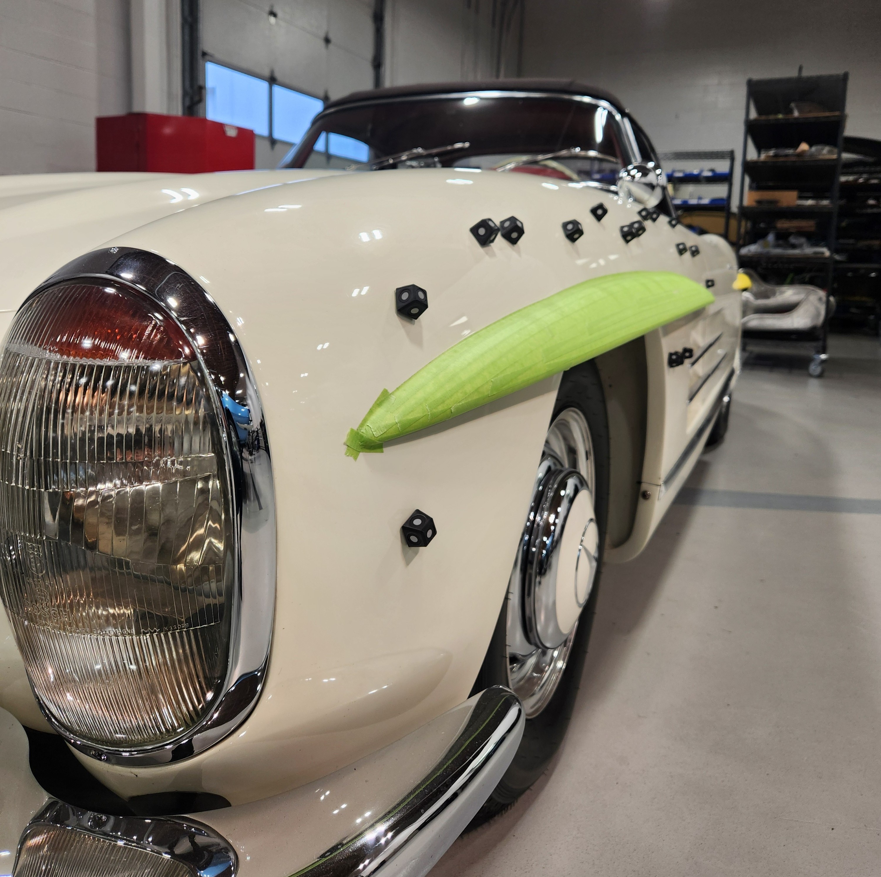 Close up of a 300sl roadster covered in reflective 3D scanning markers