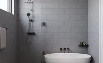 A white bath tub sitting next to a walk in shower.
