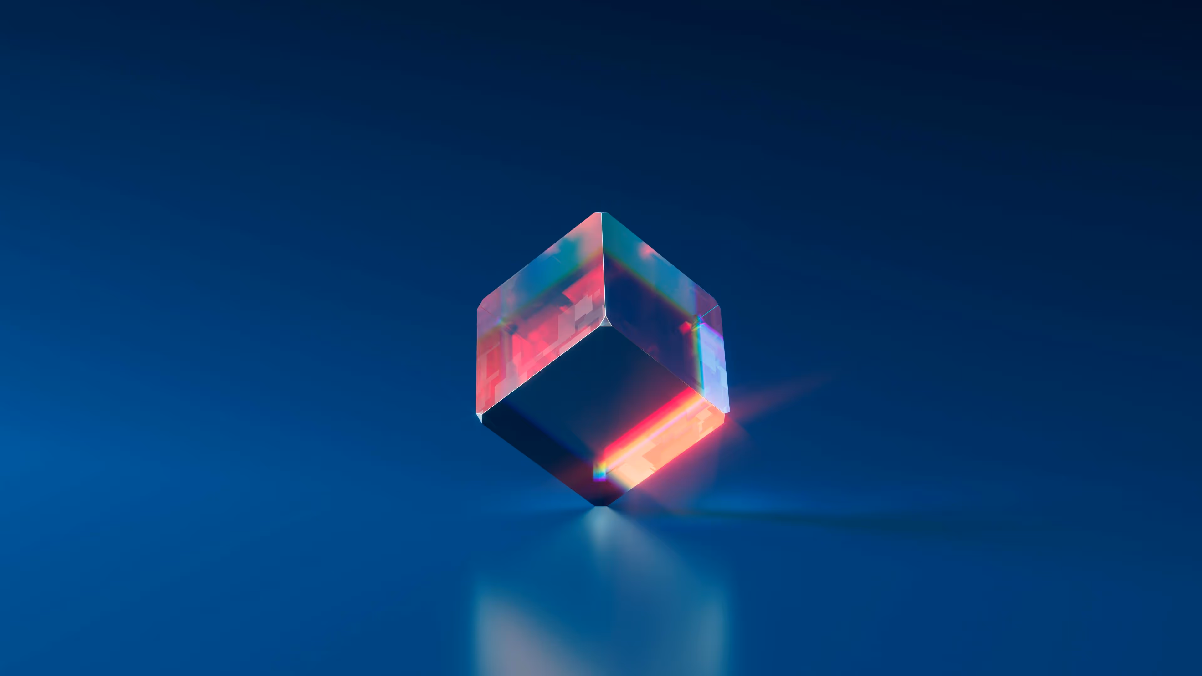 Transparent glowing cube with pink and blue reflections on a smooth surface.