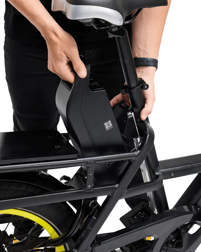 A person changing the battery from a Zoomo e-bike.
