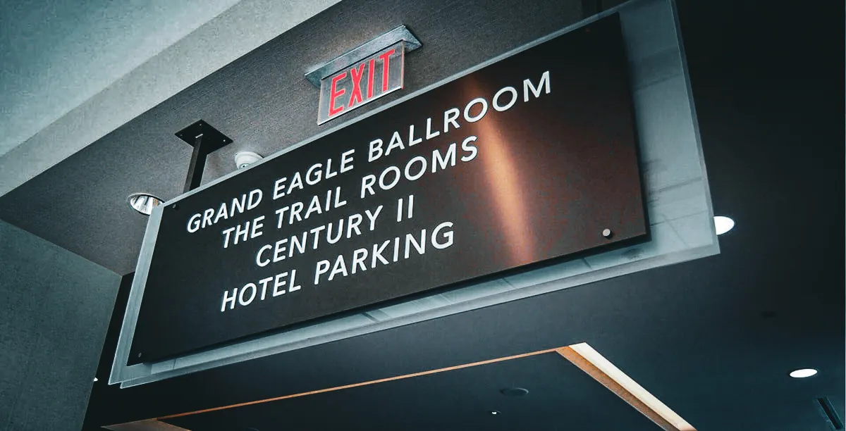 Indoor sign for Grand Eagle Ballroom and Trail Rooms at Century II Hotel Parking