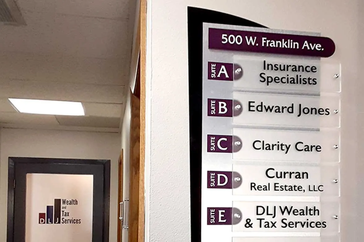 Office directory sign for 500 W. Franklin Ave with business suites