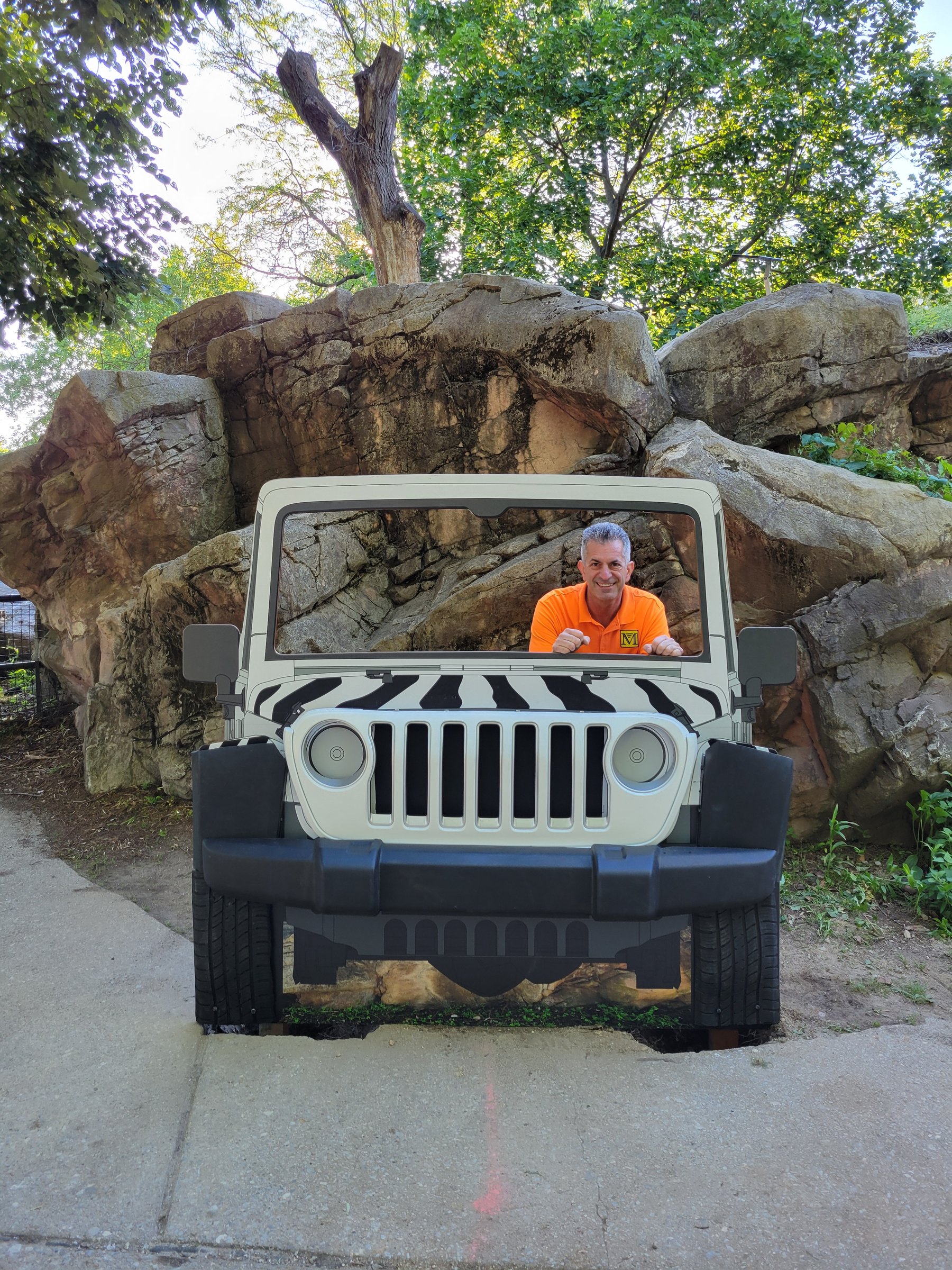 Safari Jeep photo op display installed on the rock wall at the Philadelphia Zoo