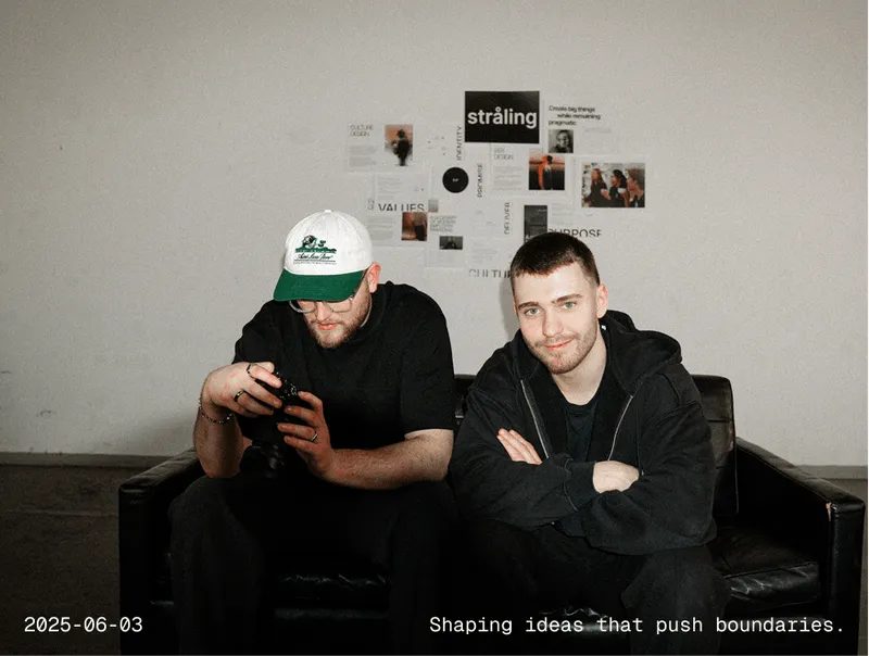 Two people are sitting on a couch and talking