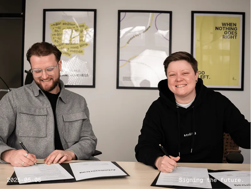 Two people at desk in business meeting