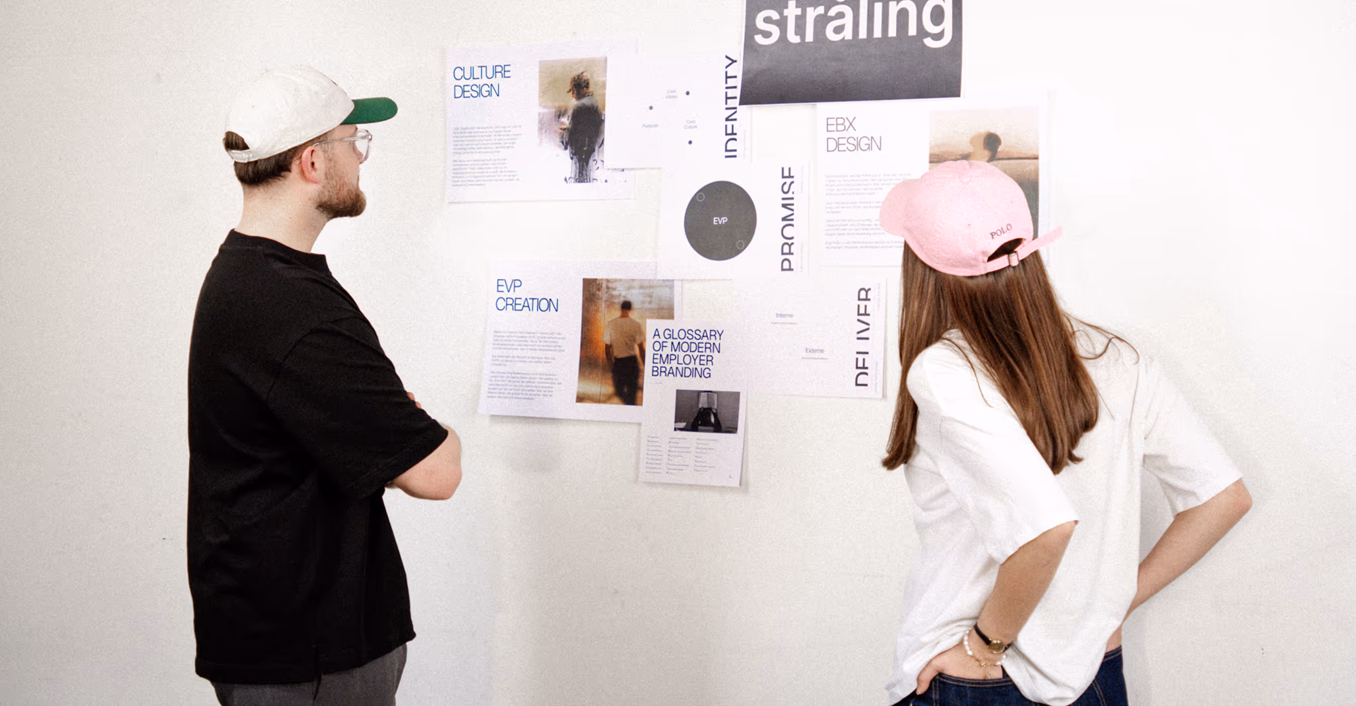 Two people discussing project materials