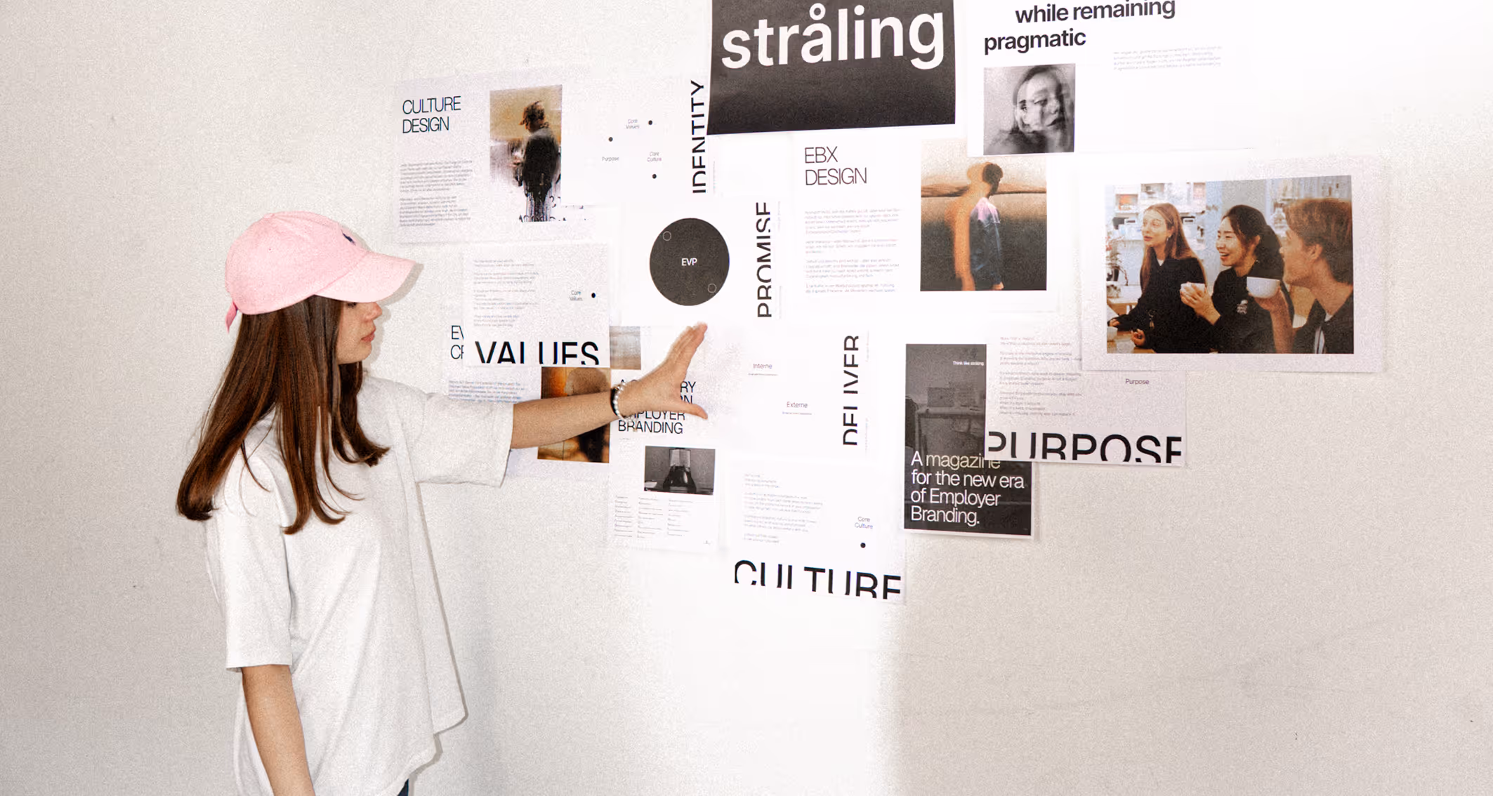 Person examining visual board with project materials