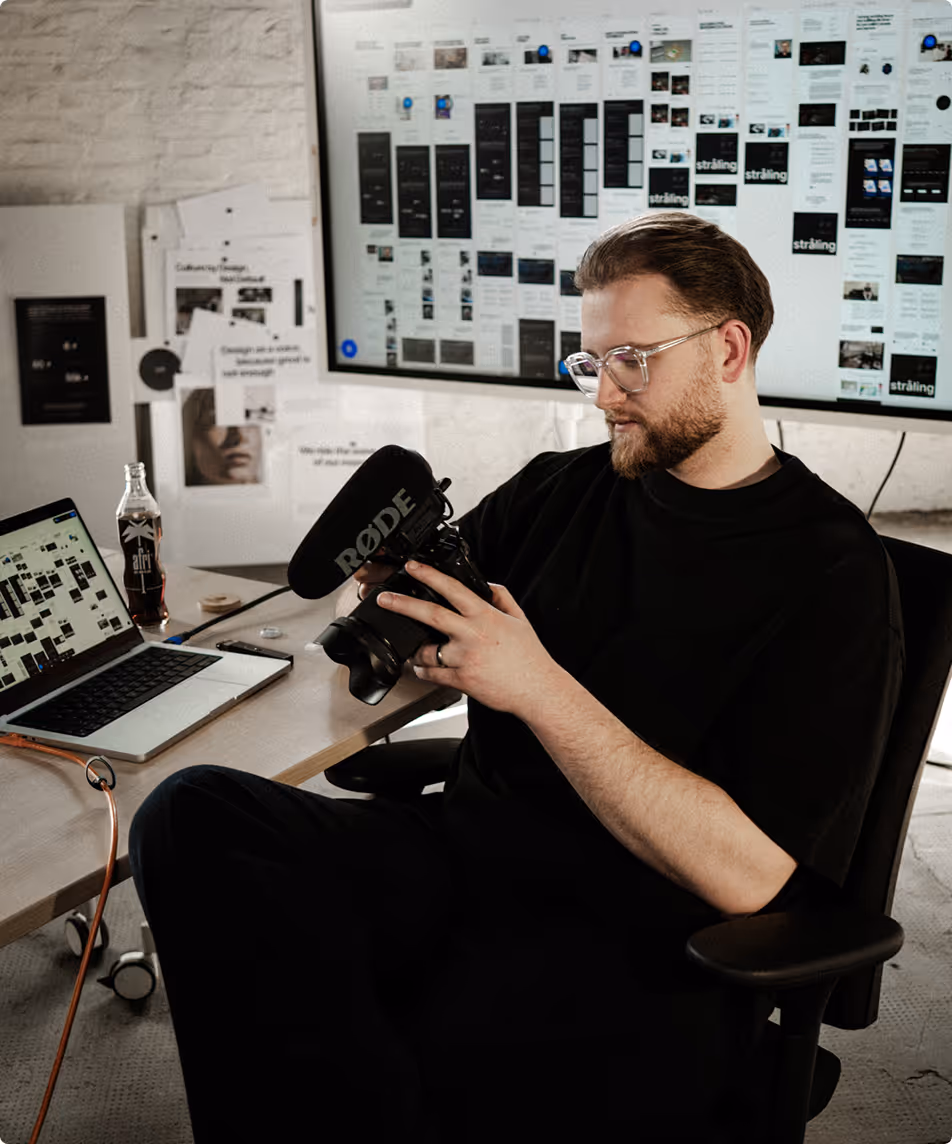 Designer working at desk with organized
