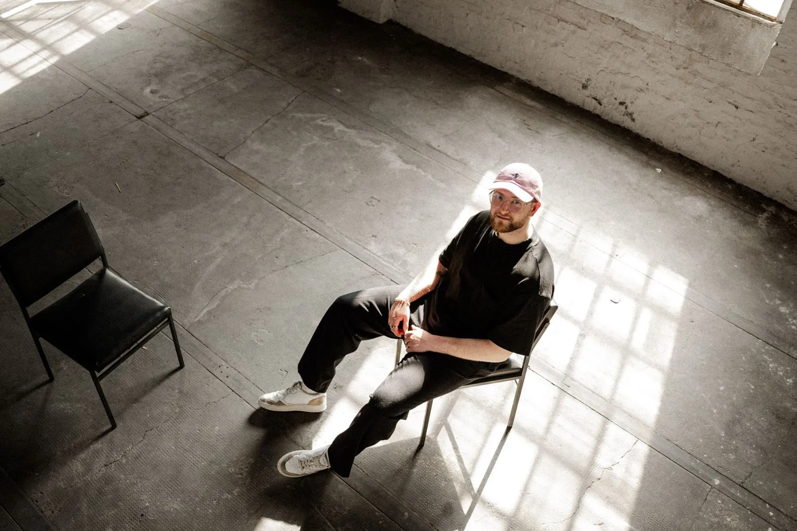 Person sitting on a chair in a loft office
