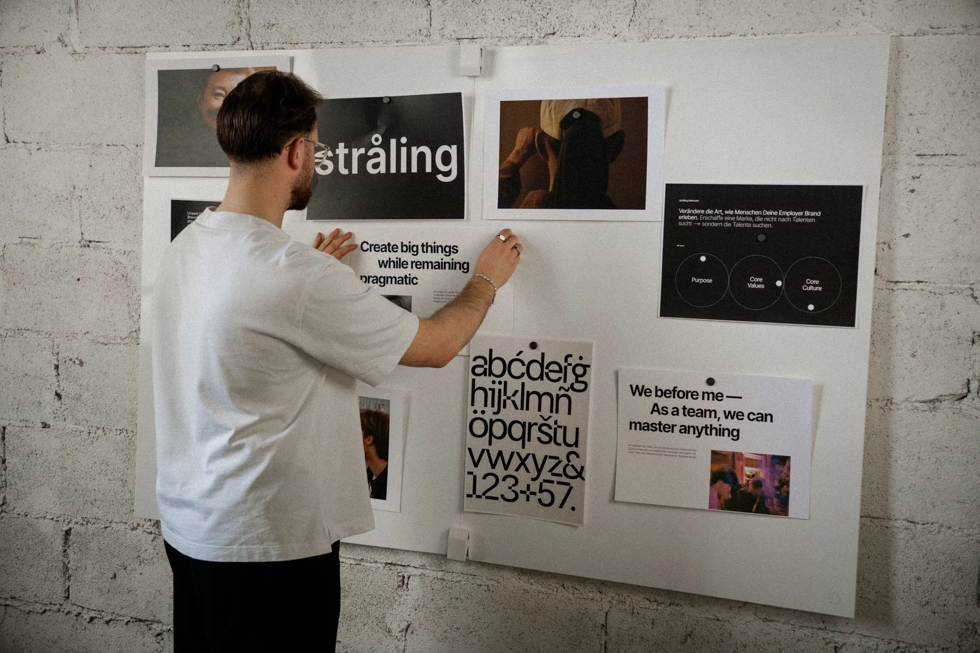 Person placing informational material on a whiteboard
