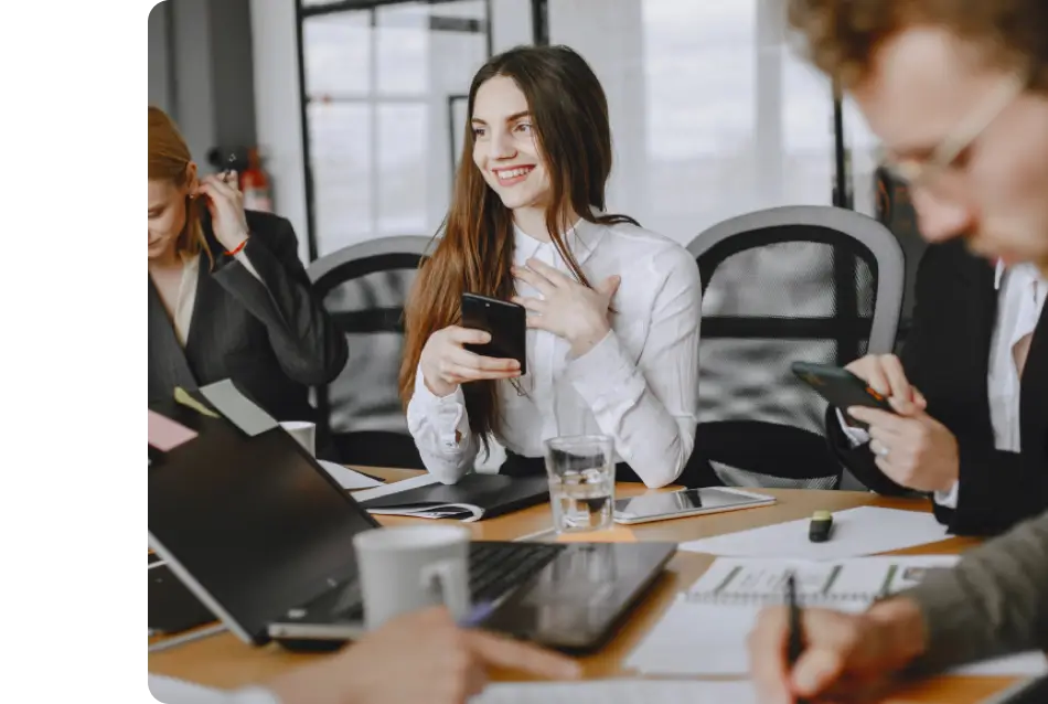 Female team member collaborates with teammates on a software platform