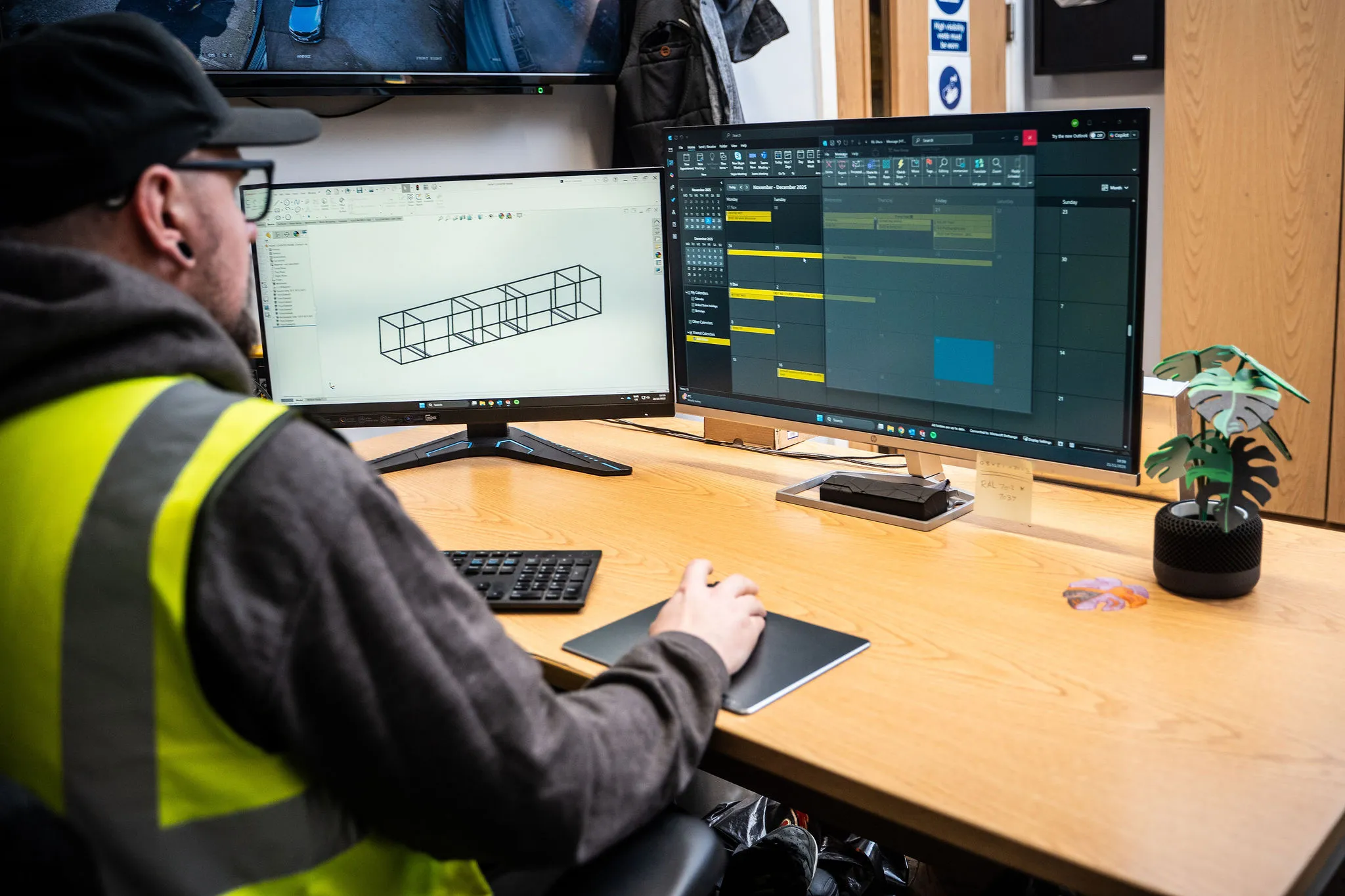 a person looking at designs on the computer