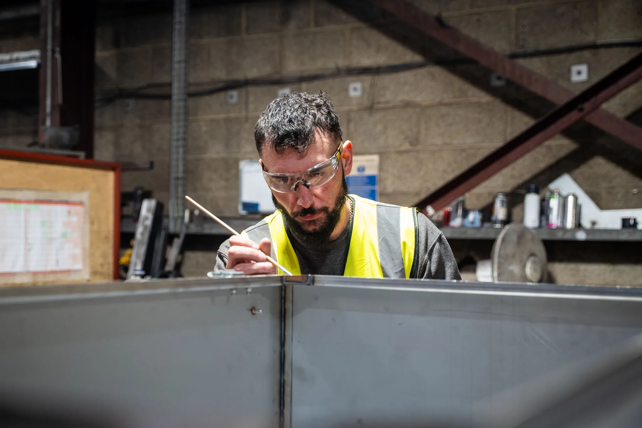 adding finishing touches to metal work