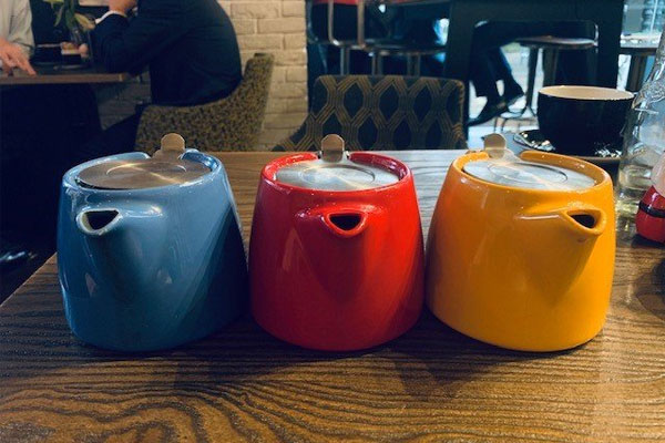 blue, red and yellow teapots